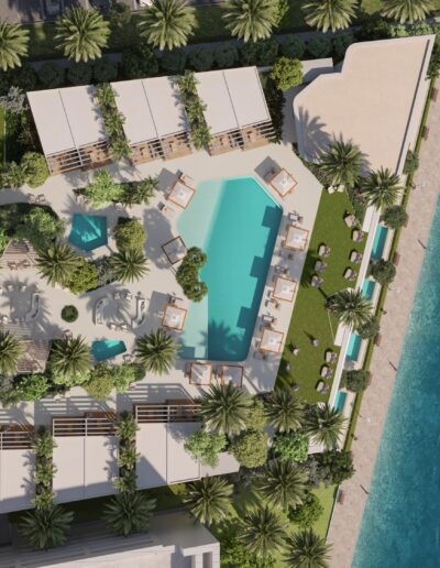 Aerial view of luxury beachfront condo in Miami with resort-style pool, tropical gardens, and ocean access